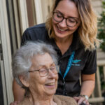 Home Care Worker Melbourne CBD supporting elderly client at home